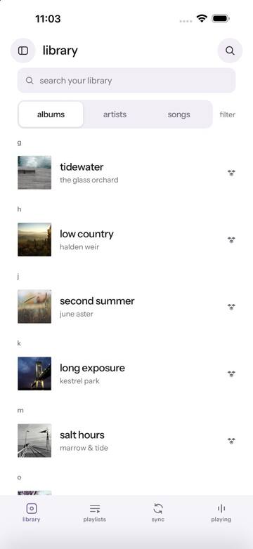 Library — albums grouped A–Z with search and album / artist / song tabs.