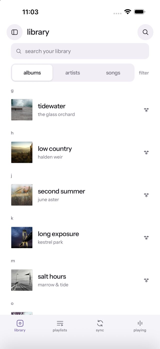 Library — albums grouped A–Z with search and album / artist / song tabs.