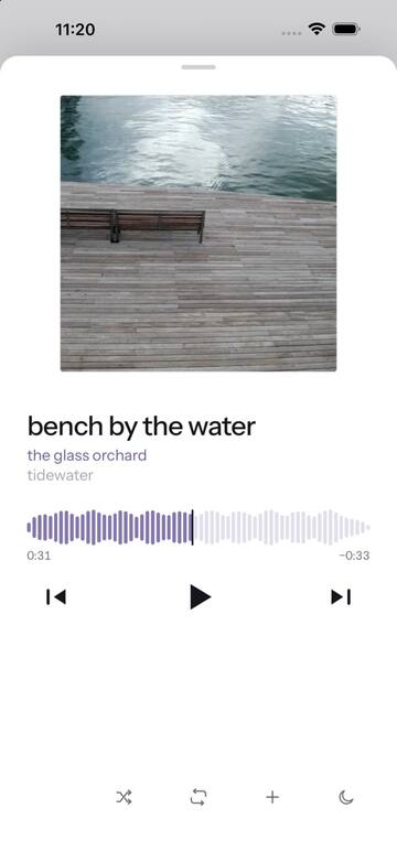 Now playing — cover art over a seek bar drawn from the track's own waveform.